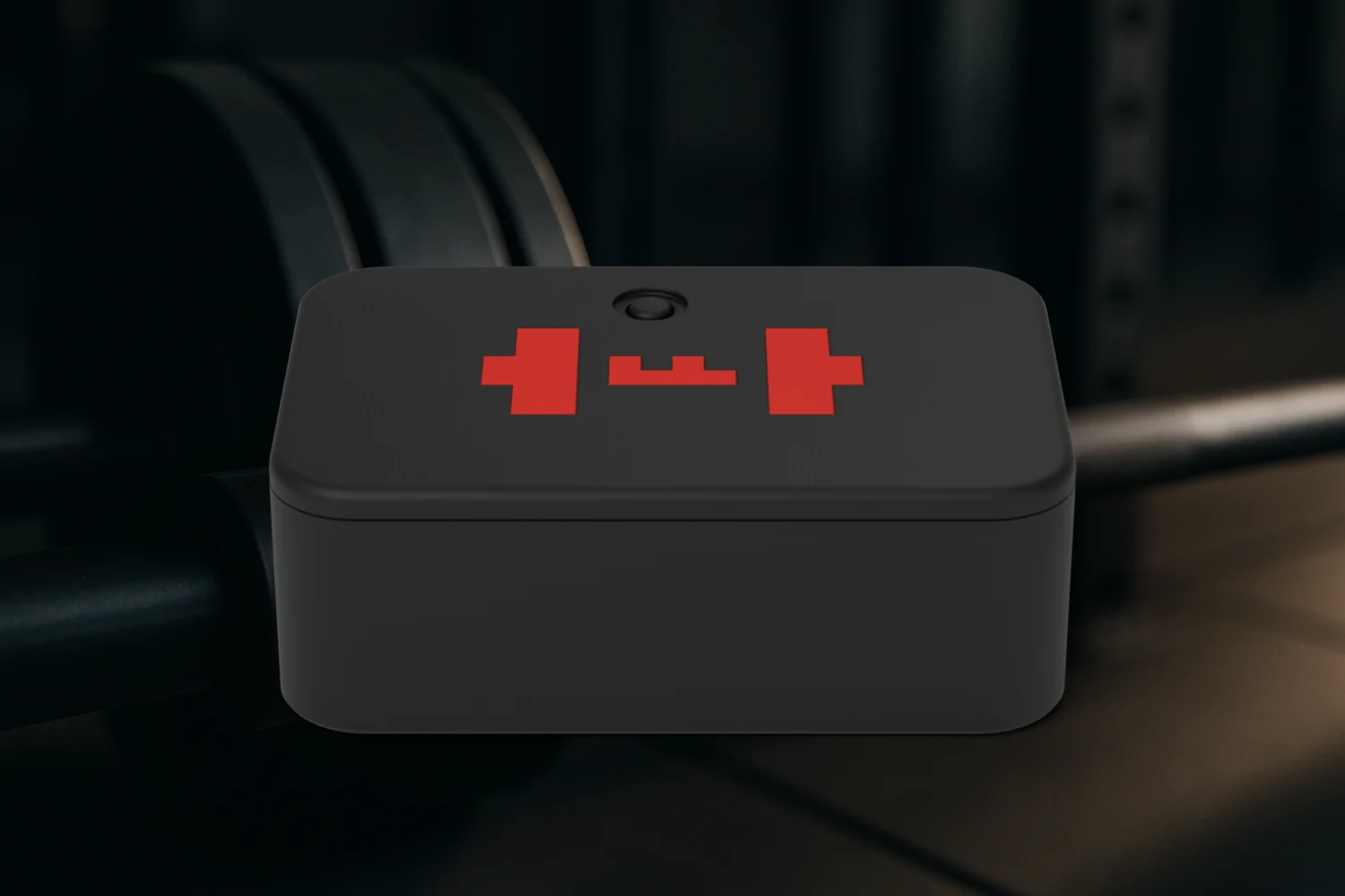 Render: the TEMPO ANVIL, a black printed puck with a red TEMPO mark, resting on the shaft of a loaded barbell in a dark gym